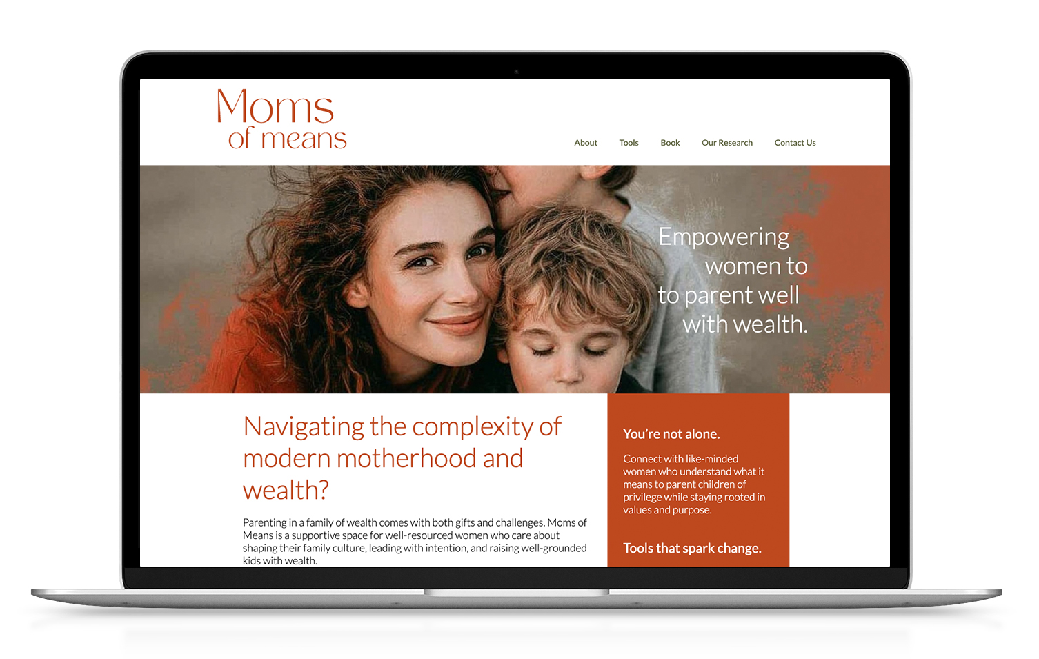 Laptop showing Moms of Means' website design